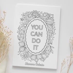 May include: Black and white coloring page featuring a decorative floral frame with the text "YOU CAN DO IT" inside. The artist's name, "Slavova Valeria", is printed at the bottom.