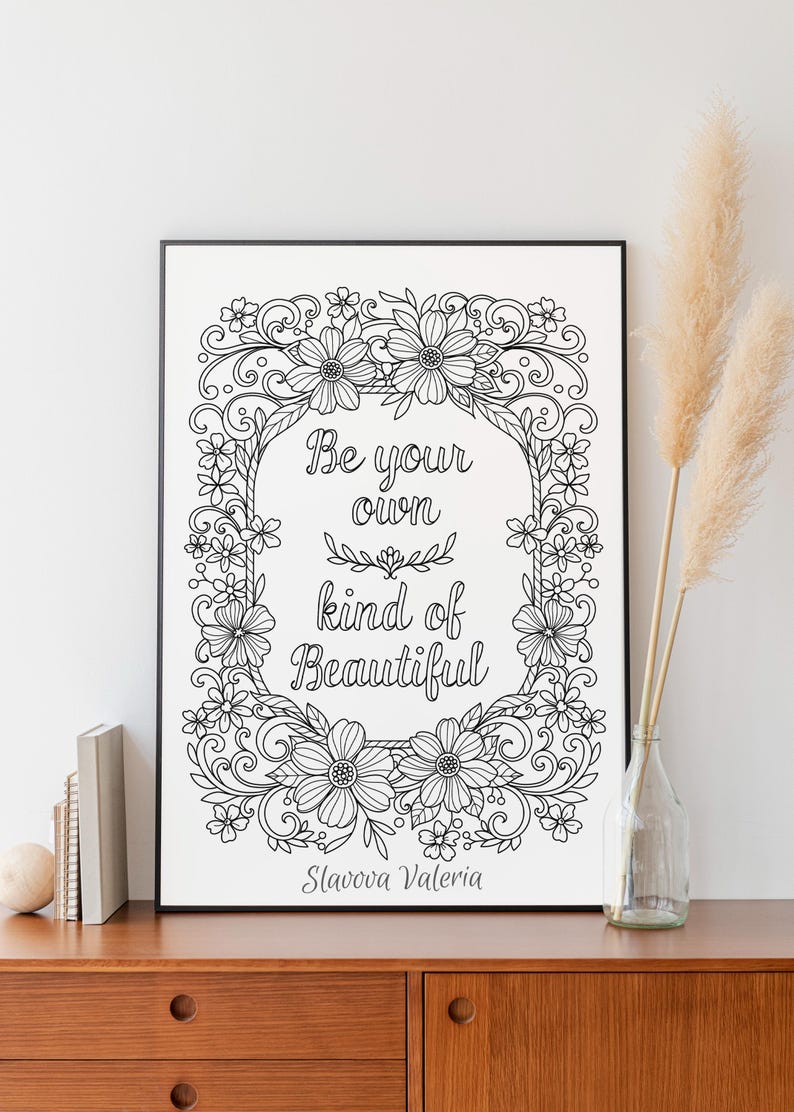 May include: Black and white printable art print with a floral frame and the quote "Be your own kind of beautiful" by Slavova Valeria.