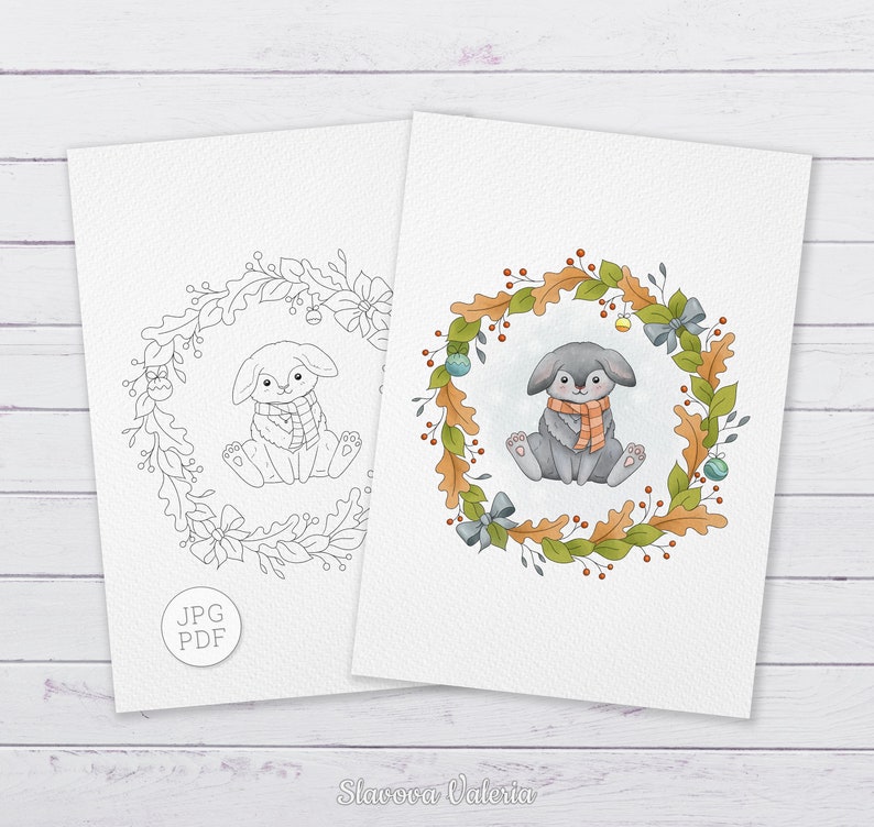 May include: A printable coloring page featuring a cute gray bunny wearing a scarf, sitting inside a wreath of autumn leaves and berries. The bunny is surrounded by a wreath of leaves and berries, with a few small ornaments hanging from the wreath. The image is in black and white, with the option to color it in.