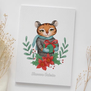 May include: A Christmas card featuring a cartoon tiger wearing a blue scarf and a grey sweater, holding a green gift box with a red bow. The tiger is surrounded by green leaves, red berries, and a red poinsettia flower. The card reads "Slavaova Valeria".