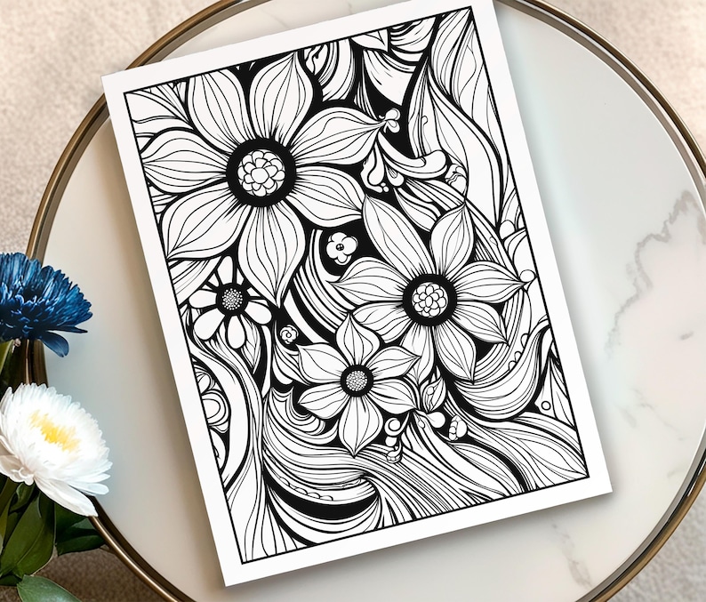 May include: Black and white floral line art print featuring detailed flower and leaf designs. The artwork is on a white paper, perfect for coloring or display. The image is set on a white and gold-rimmed surface.