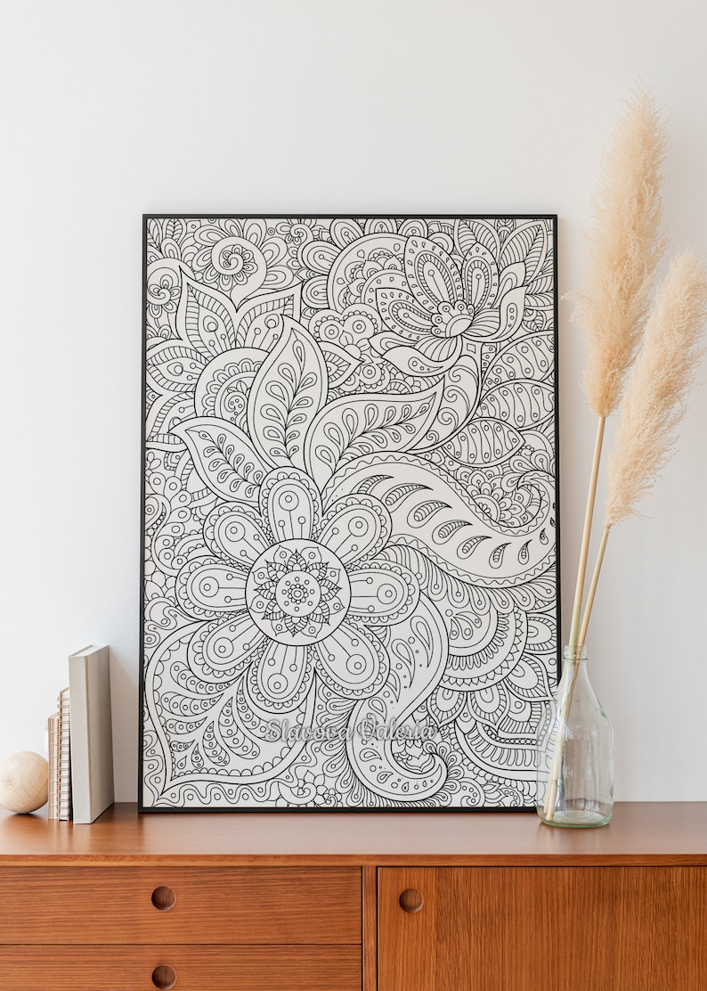 May include: Black and white framed print of an intricate floral design with paisley patterns. The design is detailed and complex, with many overlapping shapes and lines.