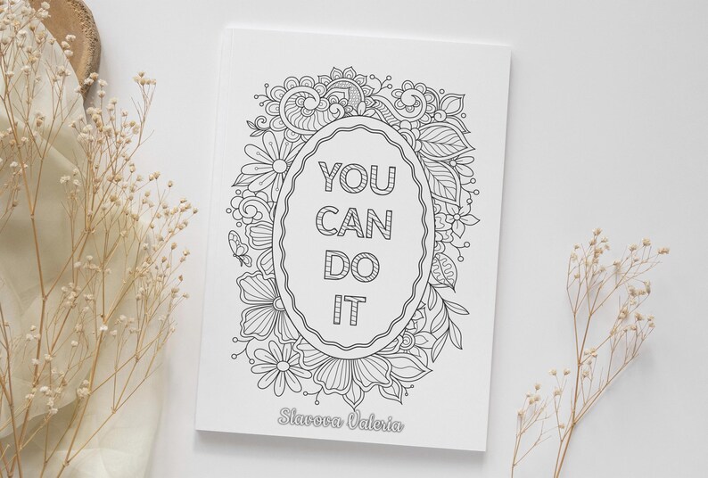 May include: A white coloring book with a floral design and the text "YOU CAN DO IT" in the center. The book is surrounded by flowers and leaves. The author's name, Slavova Valeria, is at the bottom.