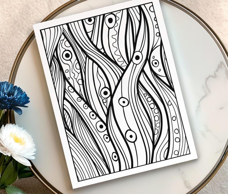 May include: Black and white abstract art print featuring a flowing, organic design with lines, circles, and various patterns. The artwork is displayed on a white background, creating a high-contrast visual effect. The print is placed on a white and gold decorative tray.