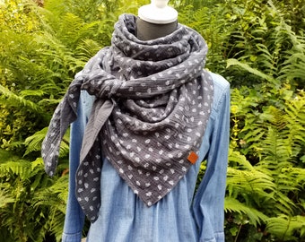 Beautiful triangular shawl made of gray muslin with small white twigs and a beautiful handmade imitation leather label