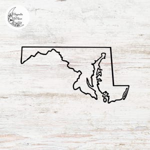 May include: A black line drawing of the state of Maryland on a white wood background.