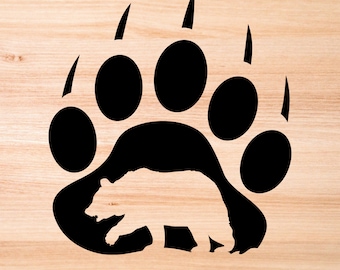 May include: Black silhouette of a bear walking inside a large bear paw print. The paw print is outlined in black and has five claws.