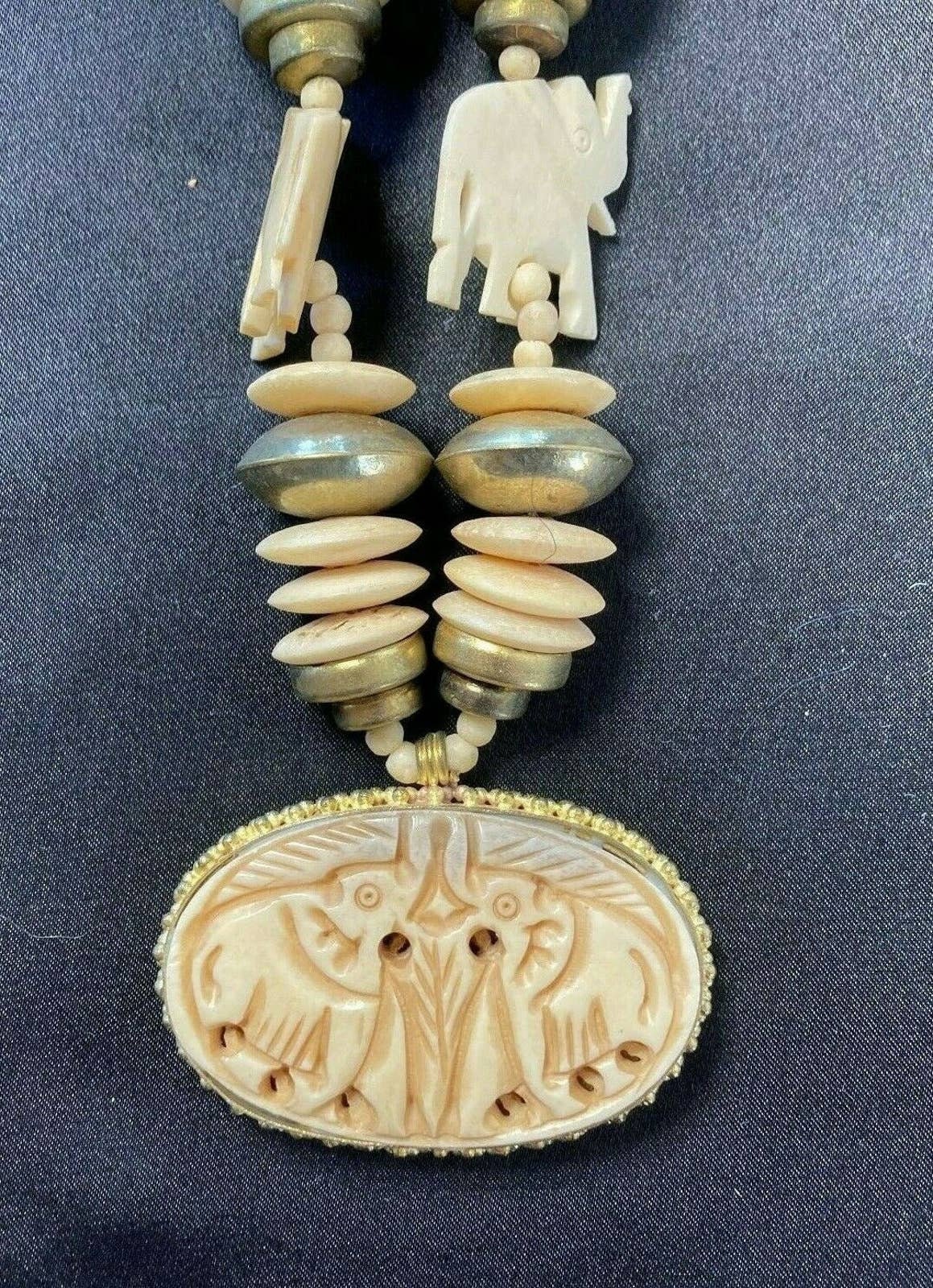 Carved elephant necklace clearance