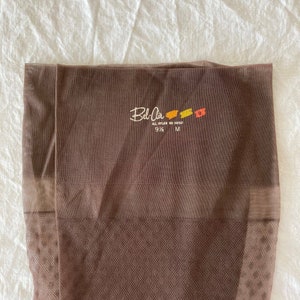 May include: Brown sheer pantyhose with a label that reads "Bel-Air All Nylon 8N 14050 9 1/2 M"