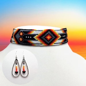 May include: A beaded choker necklace featuring a geometric diamond pattern in black, white, orange, and yellow. Included are matching teardrop-shaped earrings, each containing a single vertical strand of beads in white, orange, and black.