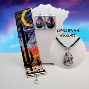 May include: A beaded bracelet, earrings, and necklace set. The bracelet features a desert landscape with a cactus and a crescent moon. The earrings and necklace pendant have a similar desert scene. The text "COMES WITH A NECKLACE" is also visible.