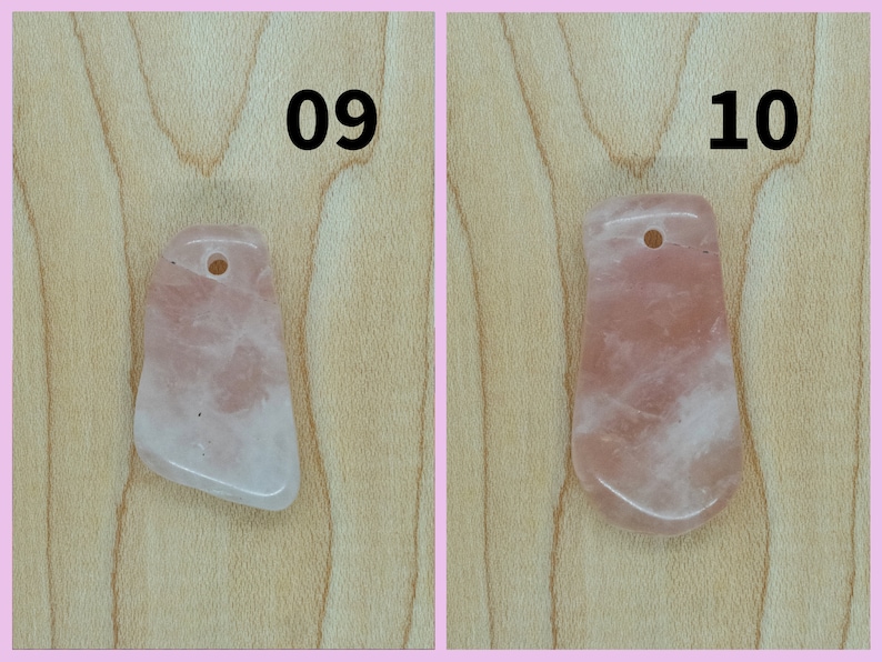 May include: Two pink rose quartz pendants with a hole at the top for stringing. The pendants are on a light brown wooden surface. The numbers 09 and 10 are written above the pendants.