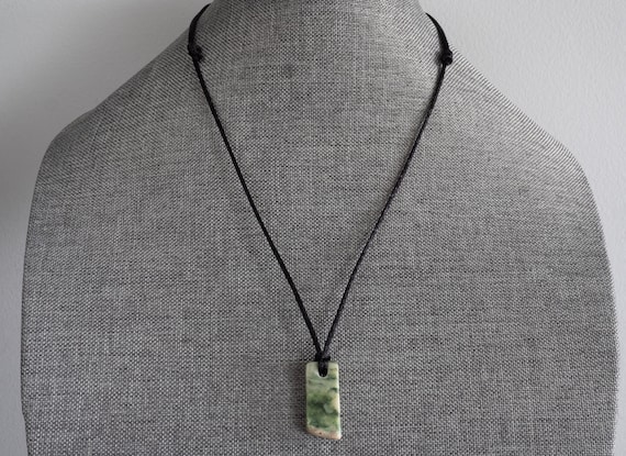 Necklace hemp or nylon cord adjustable lengths.