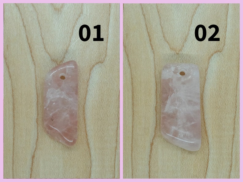 May include: Two pink rose quartz pendants with a hole drilled at the top for stringing. The pendants are on a light wood background. The pendants are labeled 01 and 02.