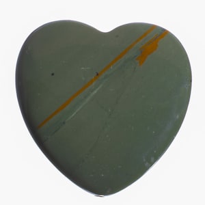 May include: A heart-shaped green stone with orange veins. The stone is polished and smooth.