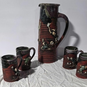 Japanese Sumida Gawa pottery pitcher and 4 mugs set