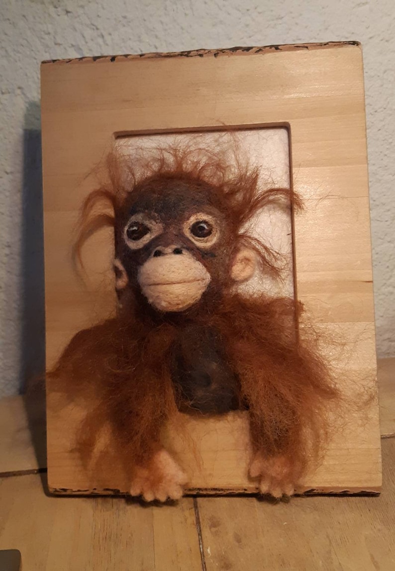 made in a painting Oerang oetan baby felted With the handmade.