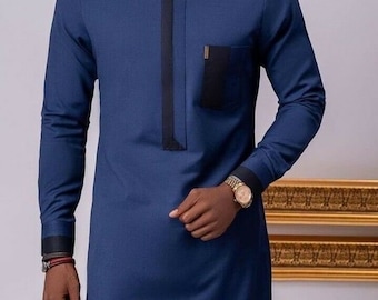May include: A long-sleeved, dark blue shirt with a black trim around the collar and cuffs. The shirt has a single pocket on the left chest with a black trim.