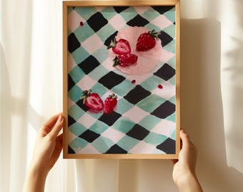 Puede incluir: Una pintura enmarcada de fresas sobre un mantel a cuadros. Las fresas son rojas y rosadas, y el mantel es verde y negro.