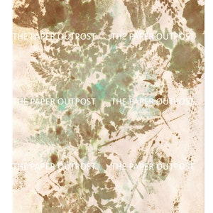 May include: Abstract art print with a light beige background and brown and green leaf patterns. The print has the text "The Paper Outpost" repeated throughout.