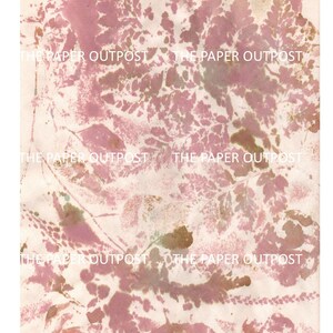 May include: Abstract art print with a pink and brown floral pattern on a white background. The print features a repeating pattern of leaves and flowers. The text "THE PAPER OUTPOST" is repeated throughout the print.