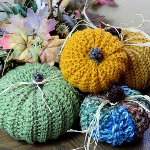 Crochet pumpkin pattern for these colorful, richly textured crochet pumpkins. Fast, easy crochet fall home decor. Craft fair crochet ideas.