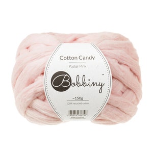 May include: A ball of pastel pink recycled cotton yarn labeled "Cotton Candy Pastel Pink" by Bobbiny. The label also states "~150g" and "100% recycled cotton".