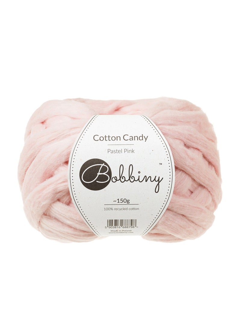 May include: A ball of pastel pink recycled cotton yarn labeled "Cotton Candy Pastel Pink" by Bobbiny. The label also states "~150g" and "100% recycled cotton".