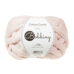 May include: A ball of pale pink yarn labeled "Cotton Candy - Nude" by Bobbiny. The label also states "~150g" and "100% recycled cotton".