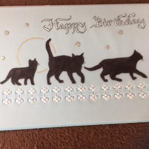 Tre gatti neri, una carta per l'amante dei gatti