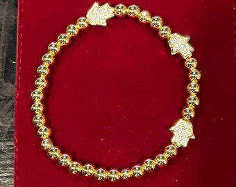 Bracelet main Hamsa : porte-bonheur rempli d'or, zircone cubique