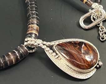 Sterling silver Pietersite gemstone pendant, necklace of wampum shell heishi beads, sterling spacers, extender and carabiner clasp sterling.