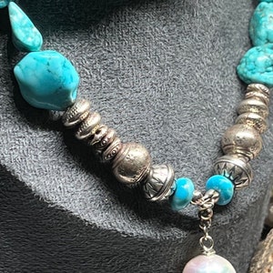 Stunning genuine turquoise large nuggets from famed Kingman mine in Arizona. Hill Tribe pure silver. pendant is a genuine fresh water pearl.