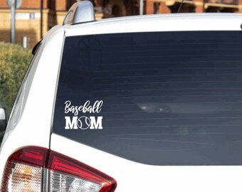 May include: White vinyl decal with the text "Baseball Mom" and a baseball graphic. The decal is on the back window of a white car.