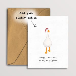 May include: A greeting card with a white goose wearing a Santa hat, with the text "happy christmas to my silly goose." The card is paired with a brown envelope. The words "Add your customization" are also visible.