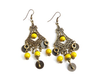 Bronze-colored earrings with oriental ornament and yellow ceramic beads