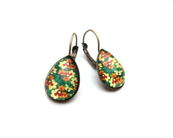 Bronze-colored earrings with drop-shaped cabochon and light yellow, orange and green flowers
