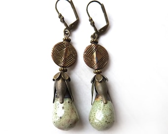 Earrings with bronze-colored ornaments and a glazed ceramic pendant