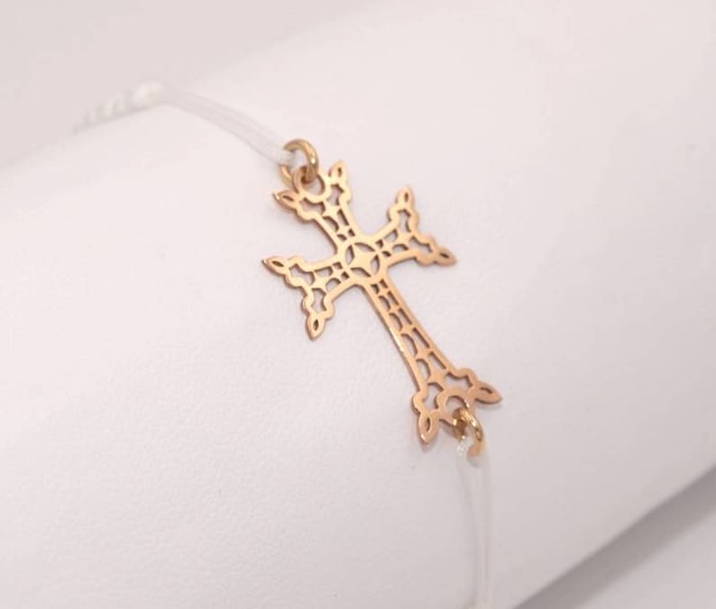 Cross bracelet openwork gold 18 Kt on braided codon white