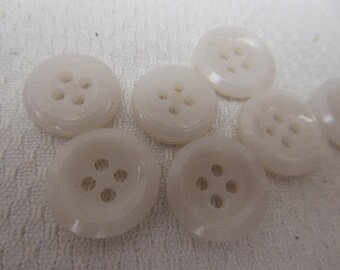 7 white glass buttons, 1.5 cm