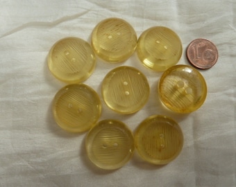 8 transparent yellow plastic buttons