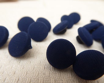 15 silk-covered blue buttons, 1 cm