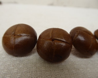 4 brown leather buttons, 2 cm