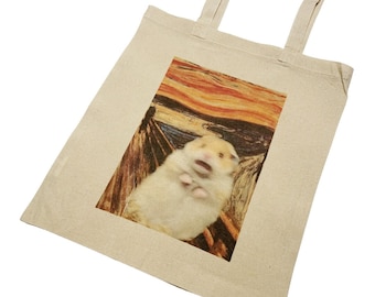 May include: A beige tote bag with a printed image of a hamster in a recreation of Edvard Munch's "The Scream" painting.