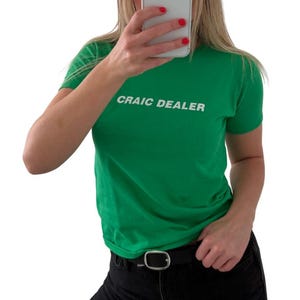Craic Dealer Baby Tee - Womens St Patricks Day Cropped T Shirt – Funny Irish Graphic – Hand Screen Printed Ringspun Cotton