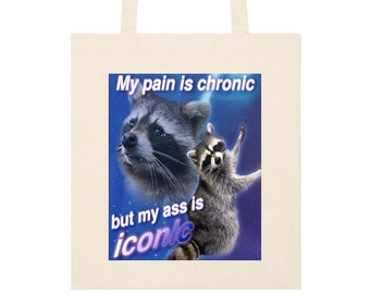 Bolsa de tela con meme de mapache: "Mi dolor es crónico"