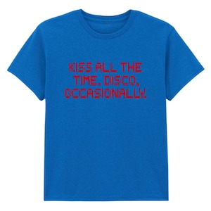 May include: A blue t-shirt with the red text "KISS ALL THE TIME. DISCO, OCCASIONALLY." The shirt has short sleeves and a crew neck. The text is centered on the front of the shirt.