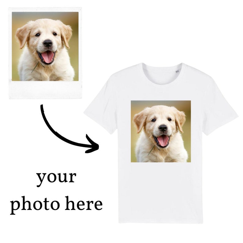 May include: A white t-shirt with a photo of a golden retriever puppy on the front. The puppy is looking at the camera and has its tongue sticking out.