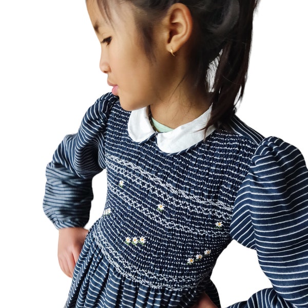 Smocked dress with loose sleeves. Navy blue striped smocked dress. Girls' smocked dress. Smocked dress with peter pan collar