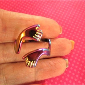 Hugging hand rainbow metal ring